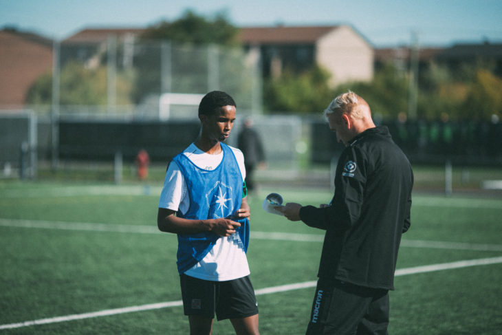 Hamdi Djama chats with Valour FC coach Rob Gale during Day 1 of the CPL's Open Trials. (Lucho Calderon/CPL)